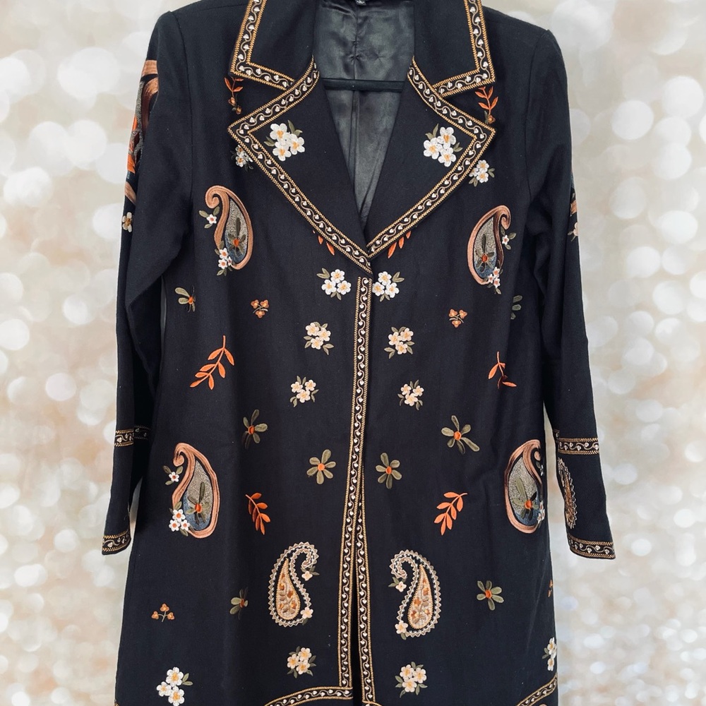 The Pyramid Collection Black Coat with paisley embroidered design.
